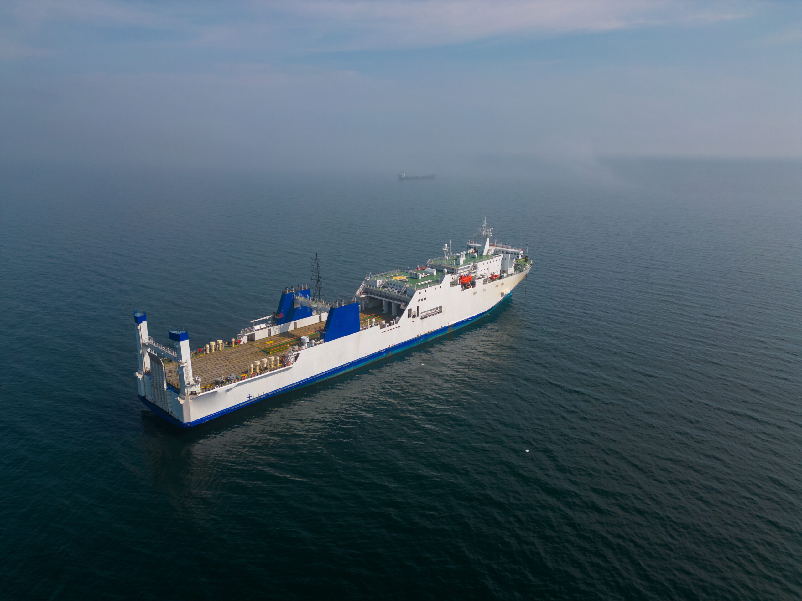 ferryboat in the sea aerial view. This vantage point can offer a unique and expansive view of the ferryboat and its surroundings, potentially showcasing the scale of the vessel and its journey.